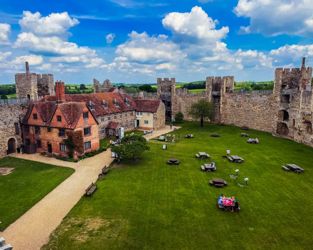 Picture of the inner bailey at Frmlingham Castle with curtain walls and large central grassy area