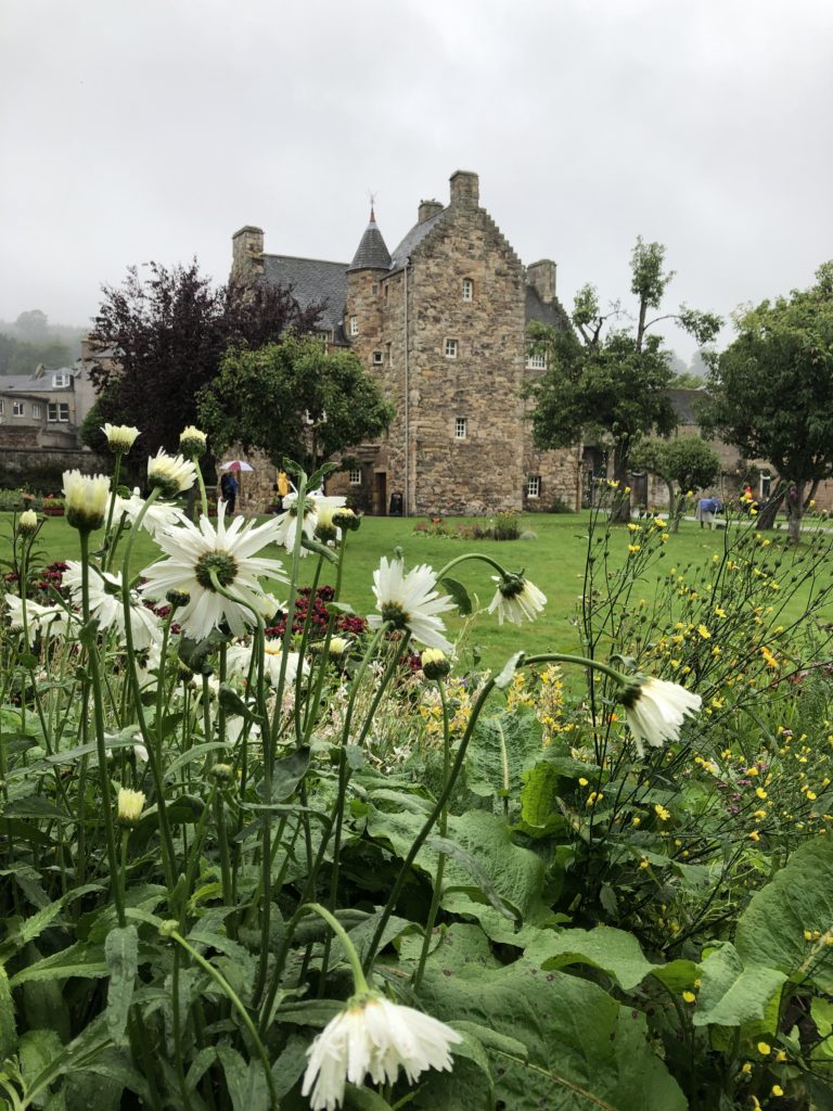 Mary Queen of Scots house at Jedburgh through flowers in the garden