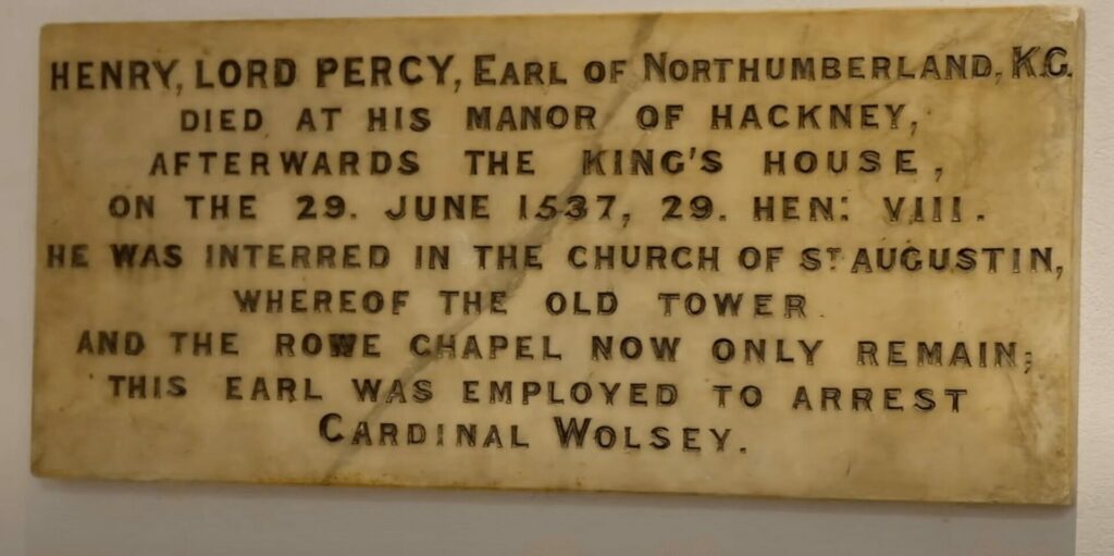 Photo of a commemorative marble plaque acknowledging the burial of Henry Percy, Earl of Northumberland in the Church of St Augustin