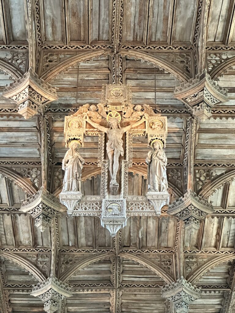 The Crucifed Christ hanging down from the sixteenth century ceiling, St David's Cathedral.